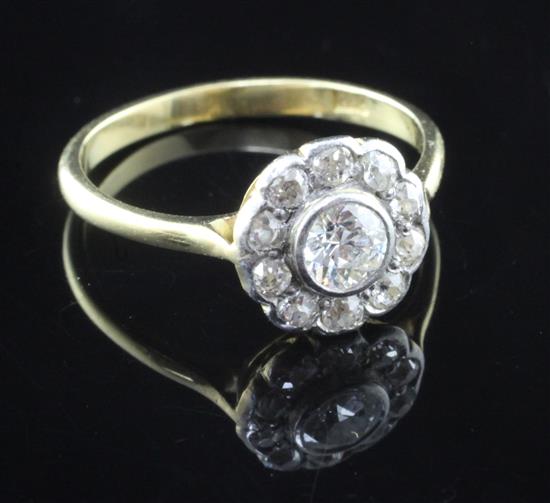 An 18ct gold and diamond cluster ring, size N.